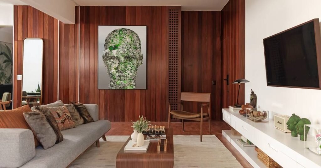 Apartamento com decoração jungle tem um quarto verde militar e outro terracota