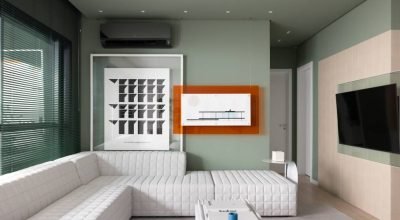 Apartamento moderno traz tons de verde e móveis com linhas orgânicas